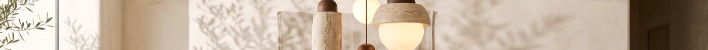 Travertine lighting in a warm modern interior — natural stone light fittings by RODESIGNE
